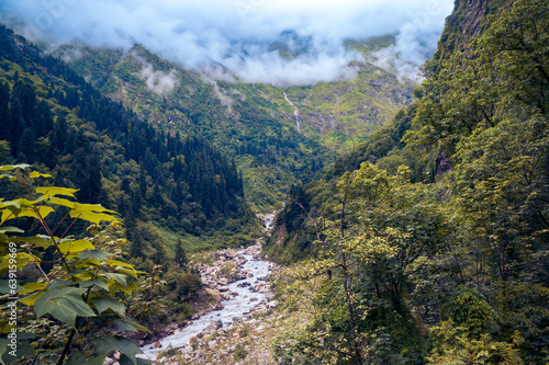 River in the Mountains. With a stunning backdrop of the mighty Himalayan ranges, scenic Valley of Flowers National Park, and a UNESCO World Heritage site. District; Chamoli, Uttarakhand, India.