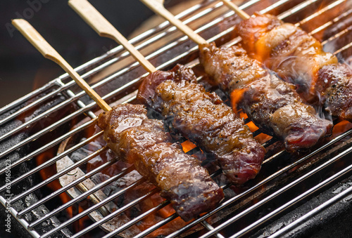wagyu Meat skewer being grilled