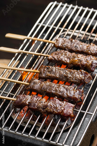 wagyu Meat skewer being grilled