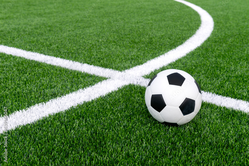 Black and white soccer and football ball in the field. Horizontal sport theme poster, greeting cards, headers, website and app Black and white soccer and football ball in the field. Horizontal sport theme poster, greeting cards, headers, website and app