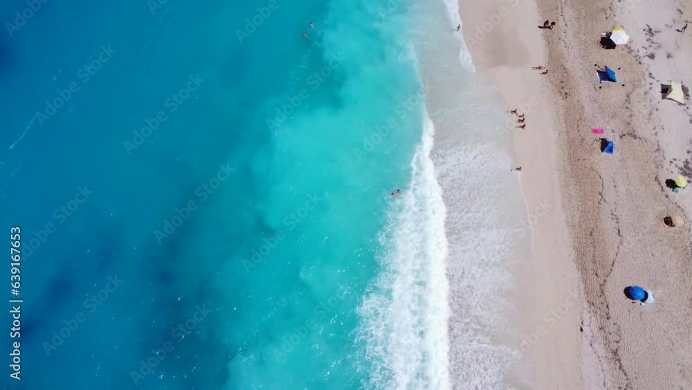 Aerial drone aerial shot in summer on paradise sandy beach Megali Petra in Lefkada. Beautiful crystal clear turquoise and blue waters. Greece Aerial drone aerial shot in summer on paradise sandy beach Megali Petra in Lefkada. Beautiful crystal clear turquoise and blue waters. Greece