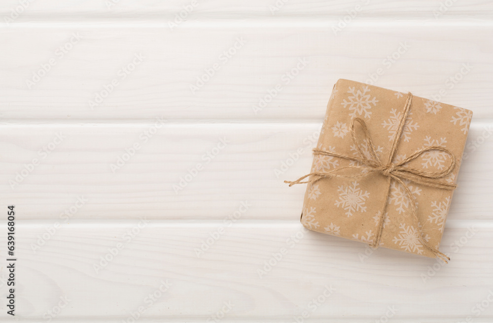 Craft christmas gift boxes on wooden background, top view Craft christmas gift boxes on wooden background, top view