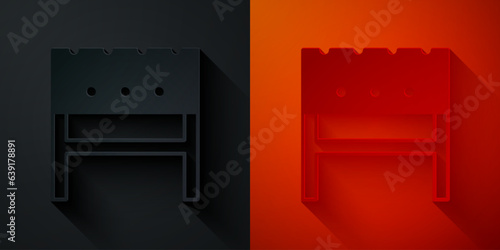 Paper cut BBQ brazier icon isolated on black and red background. Paper art style. Vector