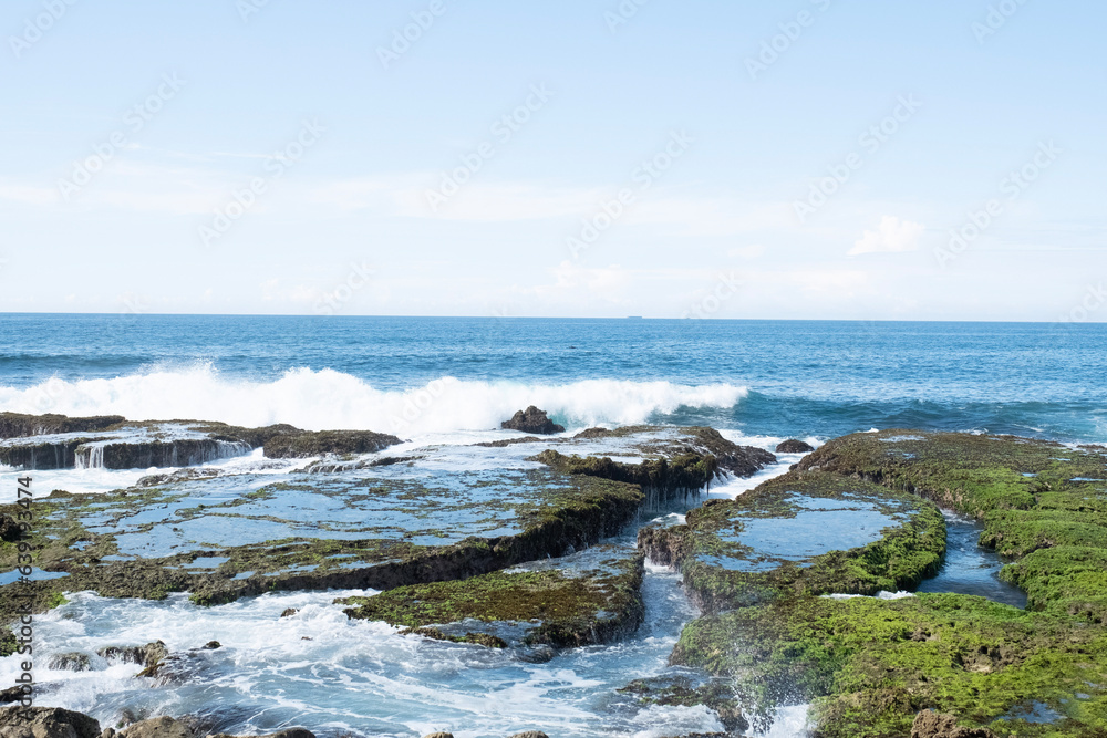 Sawarna beach,west Java,Indonesia, beautiful beach with coral reefs dotted with greenery 
