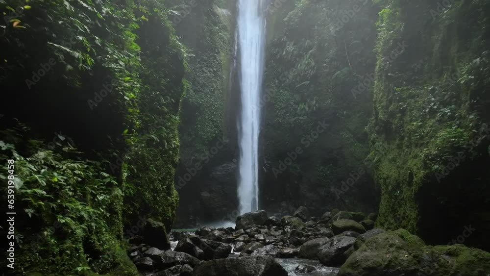 Drone shoot. Waterfall hidden in tropical rainforest jungle, falling ...