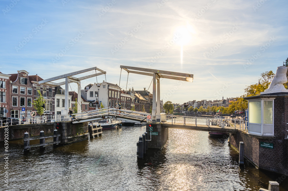 Gravestenenbrug - Bridge on Spaarne River and Old Canal Houses in Haarlem, Netherlands
