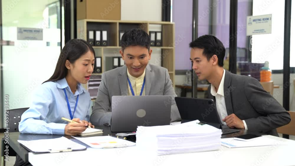 Asian business people working as a good team in the office. Successful teamwork in a meeting, workplace concept. Asian business people working as a good team in the office. Successful teamwork in a meeting, workplace concept.