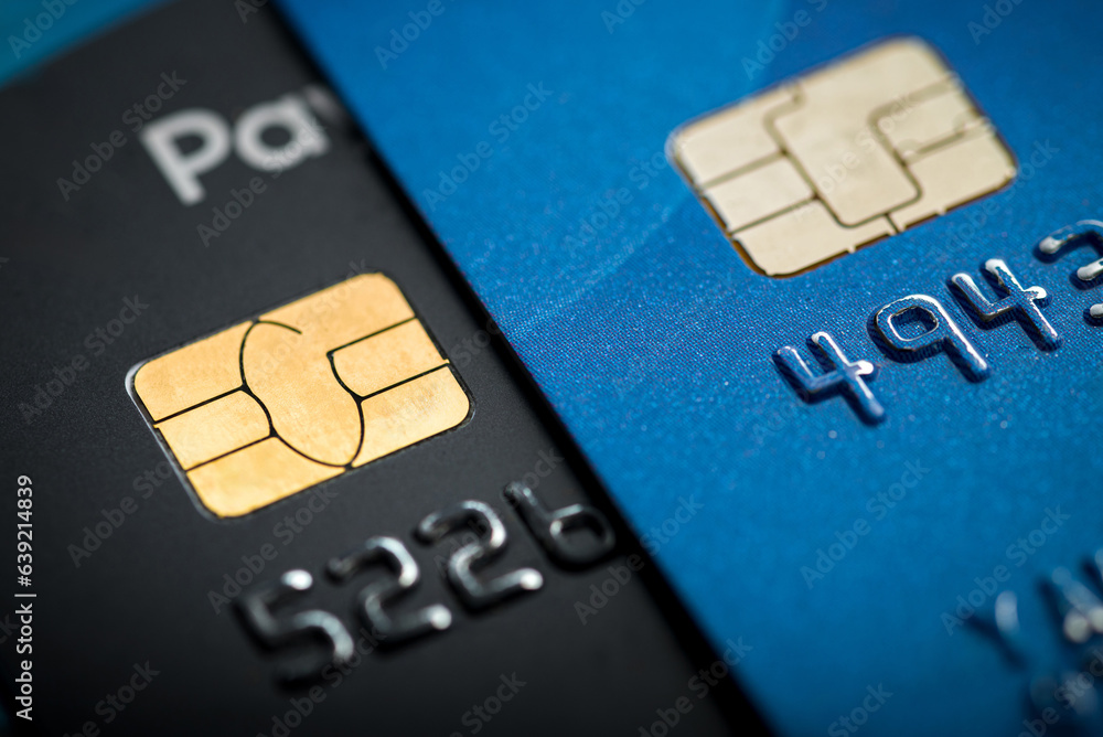Stacked credit cards with chip, close up view with selective focus for background Stacked credit cards with chip, close up view with selective focus for background