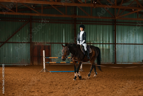 beautiful horse rider is training, equestrian sports