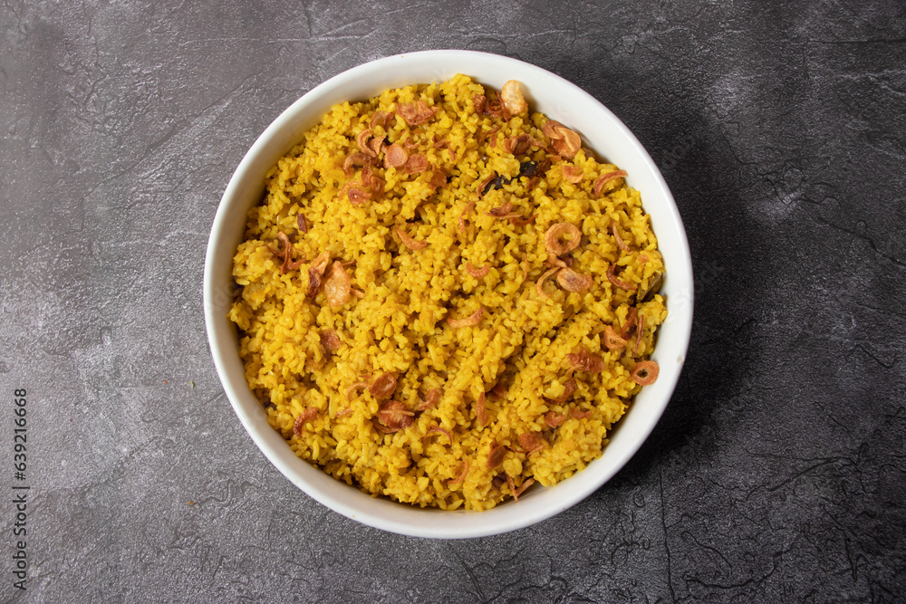 Plain bhuna Khichuri served in dish isolated on background top view of bangladesh food Plain bhuna Khichuri served in dish isolated on background top view of bangladesh food