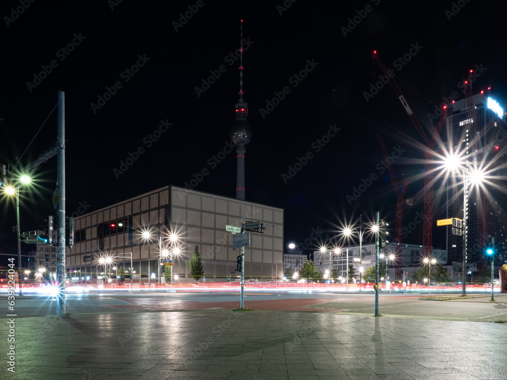Fototapeta premium View of the crossroads of the Berlin road and the light trails left by cars. Night Berlin Alexanderplatz.