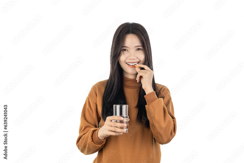Asian Young healthy woman holding pill and glass of water isolated on white background with clipping path. Health and illness concept Asian Young healthy woman holding pill and glass of water isolated on white background with clipping path. Health and illness concept