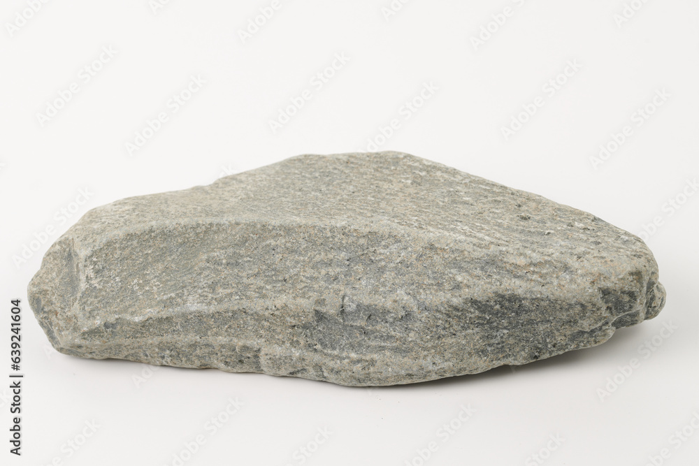 Fototapeta premium Gray flat textured stone pedestal on white background, template for mock-up, banner. Minimal concept, empty podium display product, presentation scene .