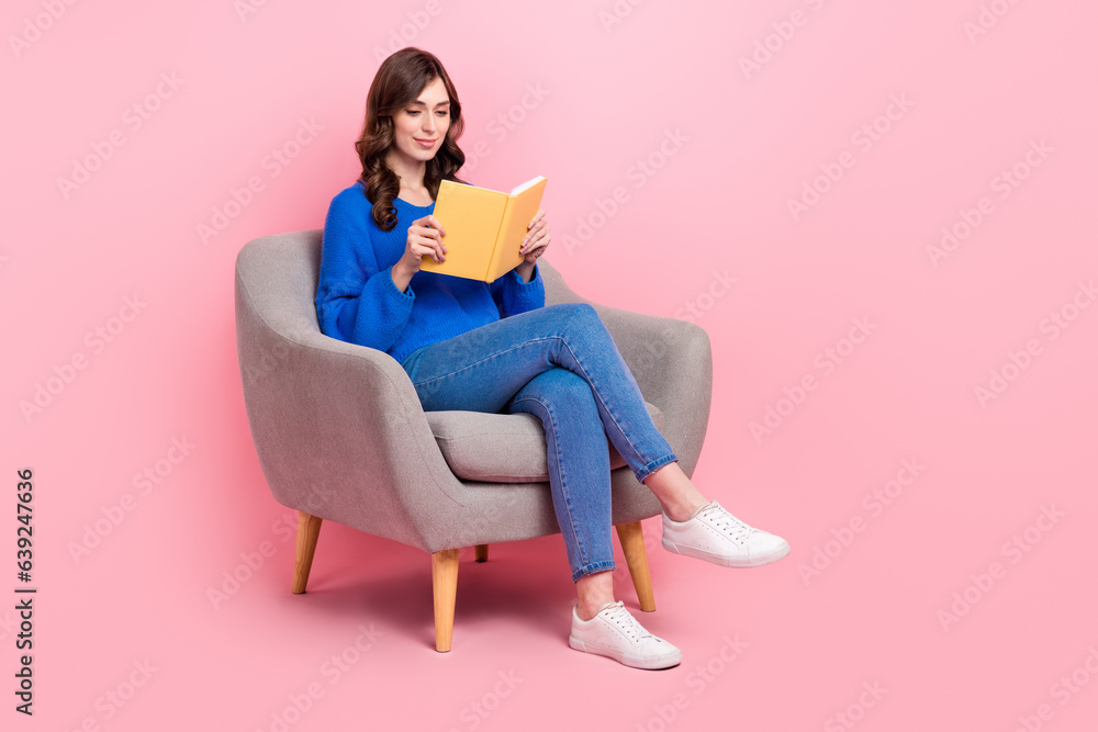 Full size portrait of gorgeous intelligent girl sit comfort chair read book empty space isolated on pink color background Full size portrait of gorgeous intelligent girl sit comfort chair read book empty space isolated on pink color background
