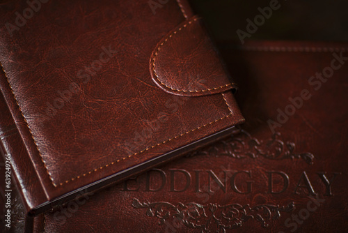 Wedding photobooks in brown leather binding. Wedding photo book, album family album. Photo books with embossing and a cover of genuine leather. Services of a professional photographer and designer. photo