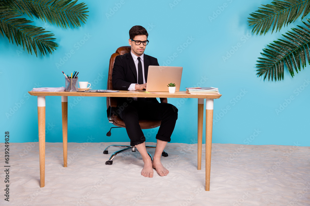 custom made wallpaper toronto digitalPhoto of representative guy sitting table working netbook search resort for summer weekends isolated coast blue color background