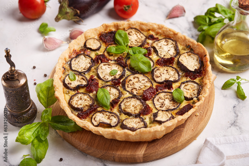 Quiche open tart pie with eggplant, sundried tomatoes and chicken meat. Savory taste. Quiche open tart pie with eggplant, sundried tomatoes and chicken meat. Savory taste.