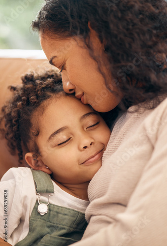 Obraz na plátne Love, kiss and mother hug girl child on a sofa with trust, support and bond at home together