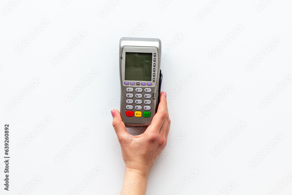 Female hand with POS payment terminal. Payment by mobile pay Female hand with POS payment terminal. Payment by mobile pay