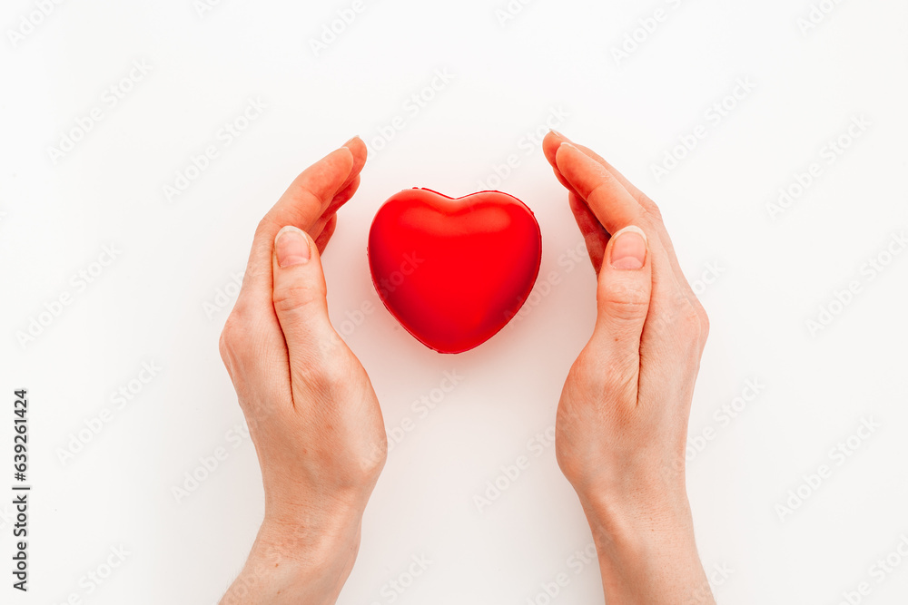 Medical and health care concept - heart with female hands