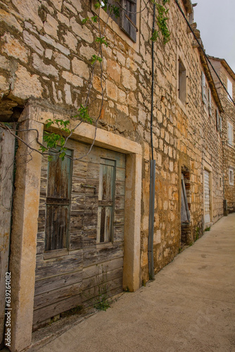 A street of historic stone houses in Milna Village on the west coast of Brac Island in Croatia