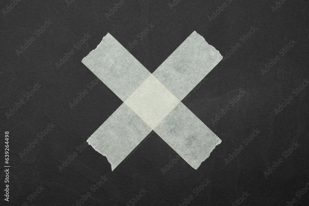Obraz premium cross, close up of an adhesive tape
