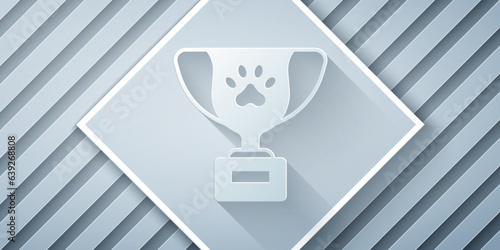 Paper cut Pet award symbol icon isolated on grey background. Medal with dog footprint as pets exhibition winner concept. Paper art style. Vector