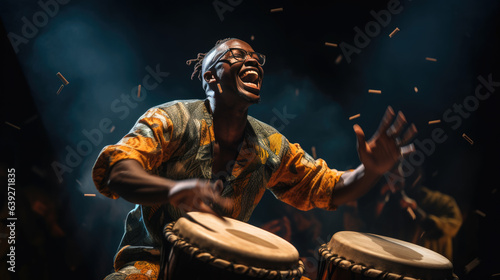 Stampa su tela African man plays the drumming drum in national dress.