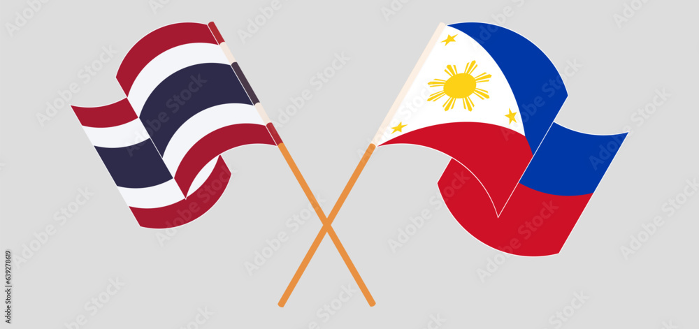 Crossed and waving flags of Thailand and the Philippines Crossed and waving flags of Thailand and the Philippines