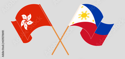 Crossed and waving flags of Hong Kong and the Philippines