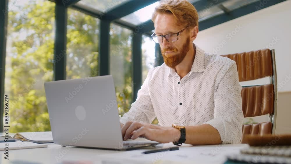 Skilled design expert using laptop to sketch new furniture Skilled design expert using laptop to sketch new furniture