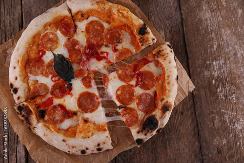 Neapolitan pizza with spicy chorizo sausage and hot peppers