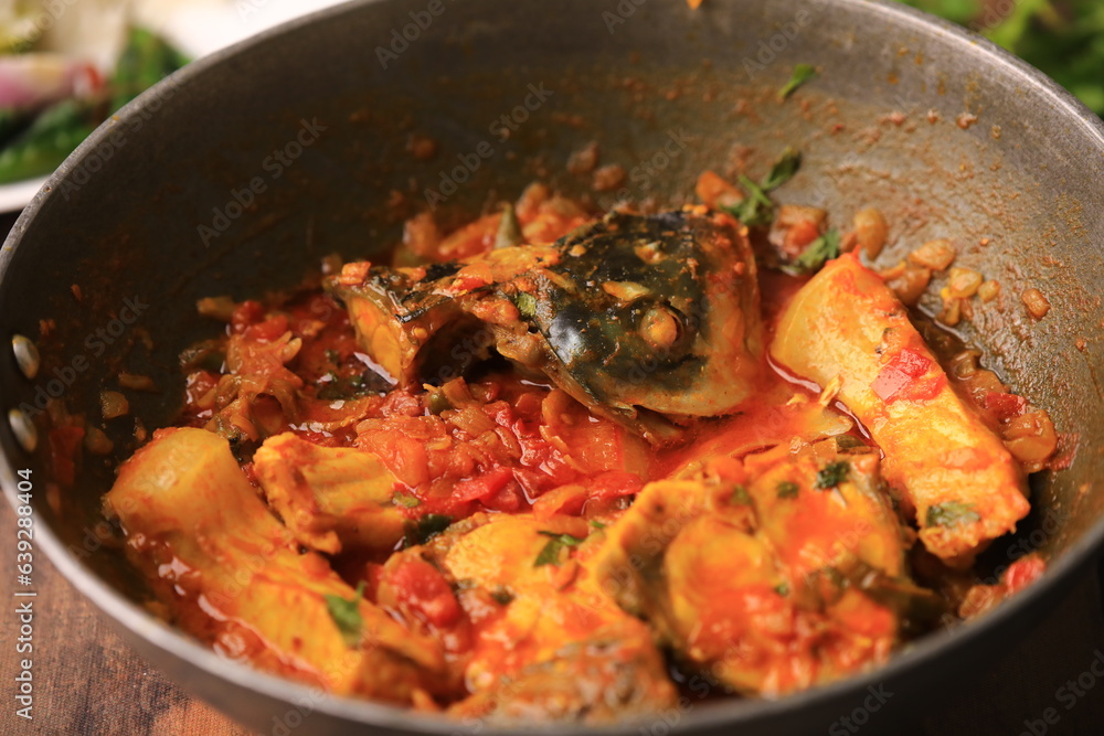 indian fish curry served with rice in a bowl closeup with selective focus and blur indian fish curry served with rice in a bowl closeup with selective focus and blur