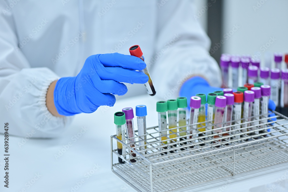 Medical technologist using diagnostic equipment in a cancer hospital lab in Asia Medical technologist using diagnostic equipment in a cancer hospital lab in Asia