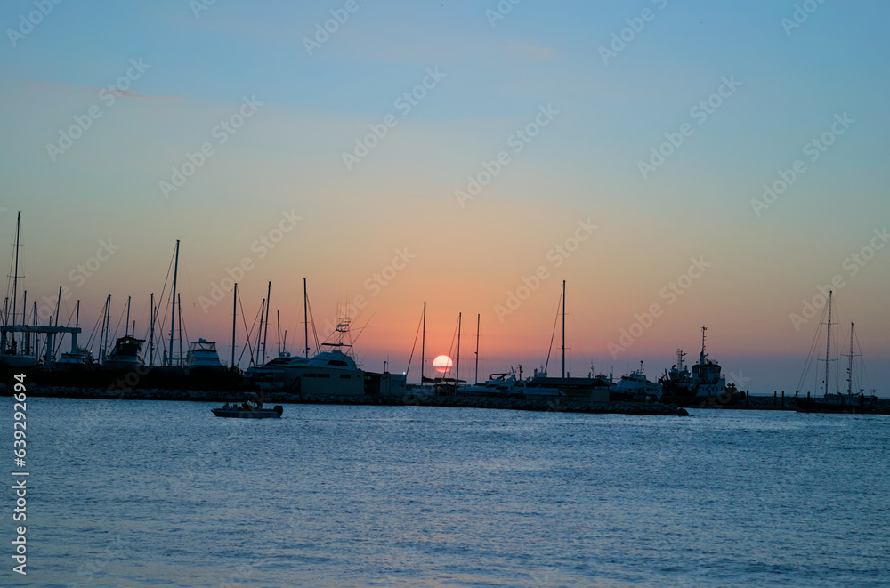 Santa Marta, Colombia - December 30 2022: Scenic view of a port in Santa Marta, Colombia during the sunset