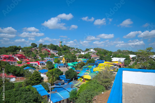 Usiacuri, Colombia - January 4 2023: Aerial panorama of Usiacuri, Colombia at noon with colorful houses and rooftops