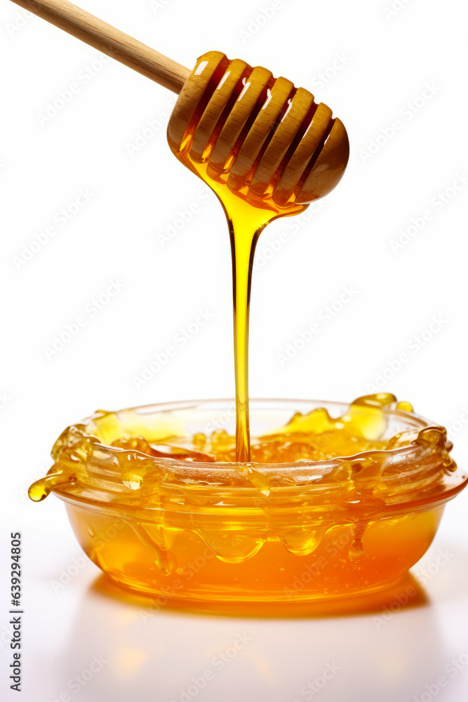 Honey dip being poured into bowl of honey syrup with wooden spoon. Honey dip being poured into bowl of honey syrup with wooden spoon.