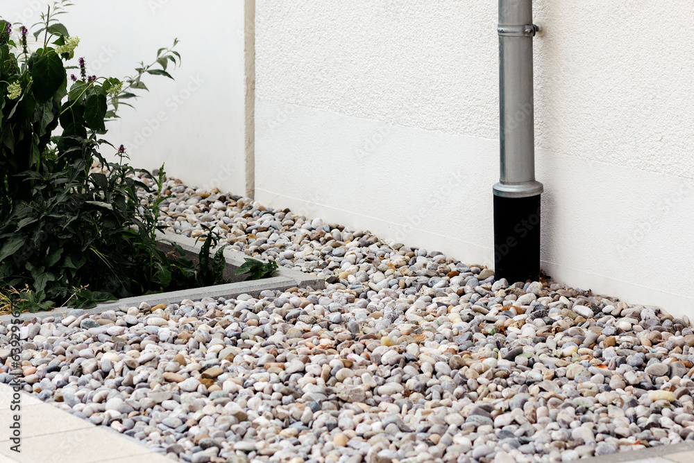 Drainage Around House. PVC pipe. Water Drainage Pipe. French Drain. Drain Pipe Downpipe into