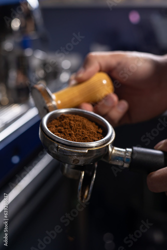 A bartender prepares coffee, close-up
