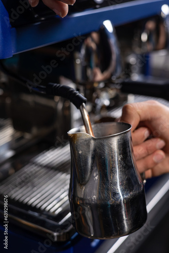 A bartender prepares coffee, close-up