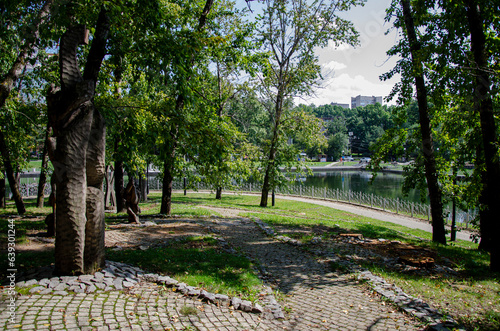 Fototapeta Naklejka Na Ścianę i Meble -  Leisure park area with trees and green lawn
