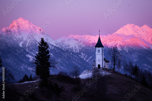Jamnik church (Slovenia) with Kamnik-Savinja Alps in background