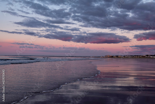 Beautiful colorful seascape at sunrise. Calm expanse of the sea. Coast of the Atlantic Ocean. USA. Maine 