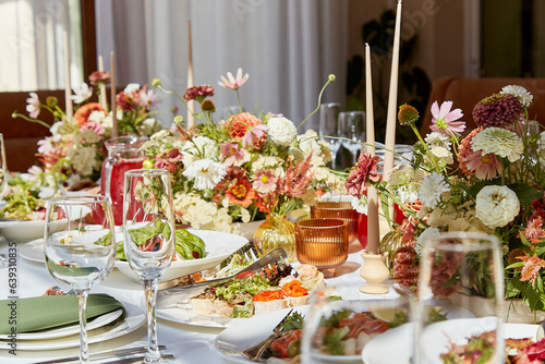 Aesthetics table setting with candles and flowers design. Restaurant chamber event in provence style.