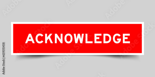 Sticker label with word acknowledge in red color on gray background