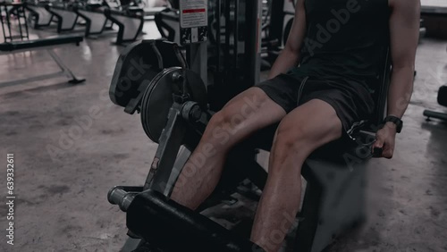Leg muscle building for bodybuilders, Men's leg exercises with stretching machines in the gym, Exercise your legs in the gym with stretching machines, Strength and Flexibility Workout.