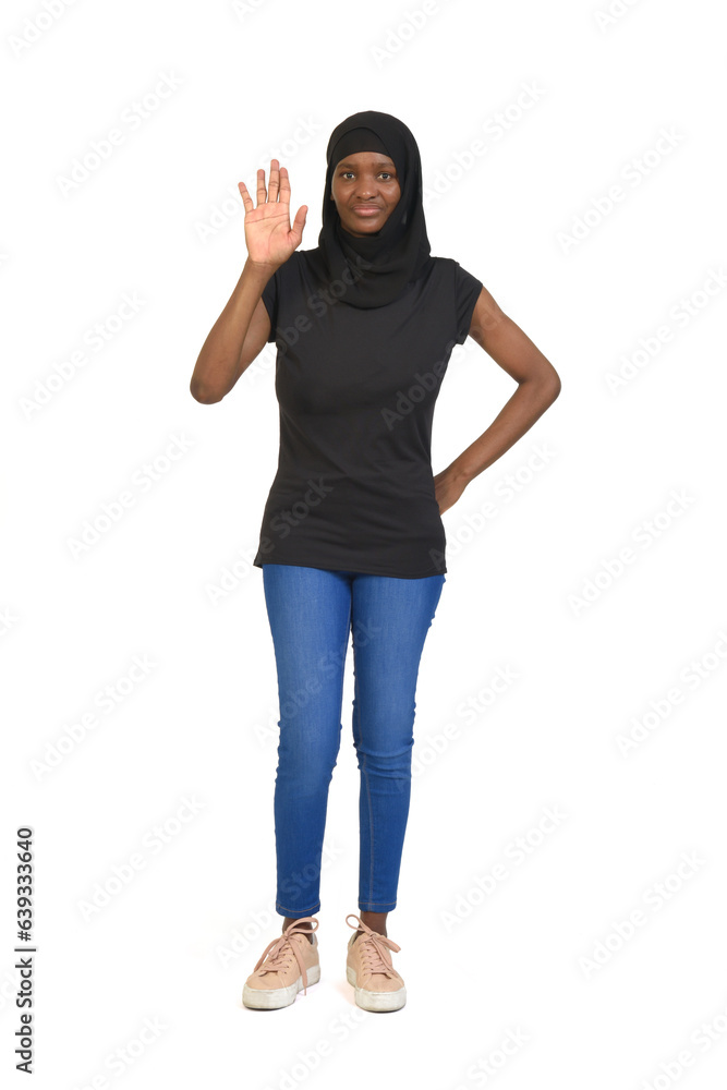 front view of a woman with burqa showing her palm of hand on white background front view of a woman with burqa showing her palm of hand on white background