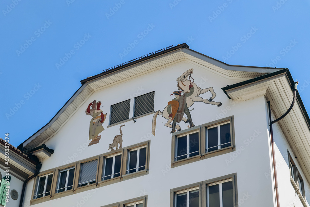 Lucerne, Switzerland - August 10, 2023: Beautiful painted facades in the downtown Lucerne in Switzerland on a sunny summer day