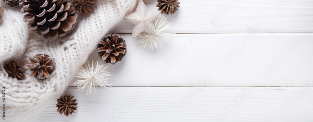 Christmas card with white wool scarf and pine cones lying on white wooden table with copy space, legal AI Christmas card with white wool scarf and pine cones lying on white wooden table with copy space, legal AI