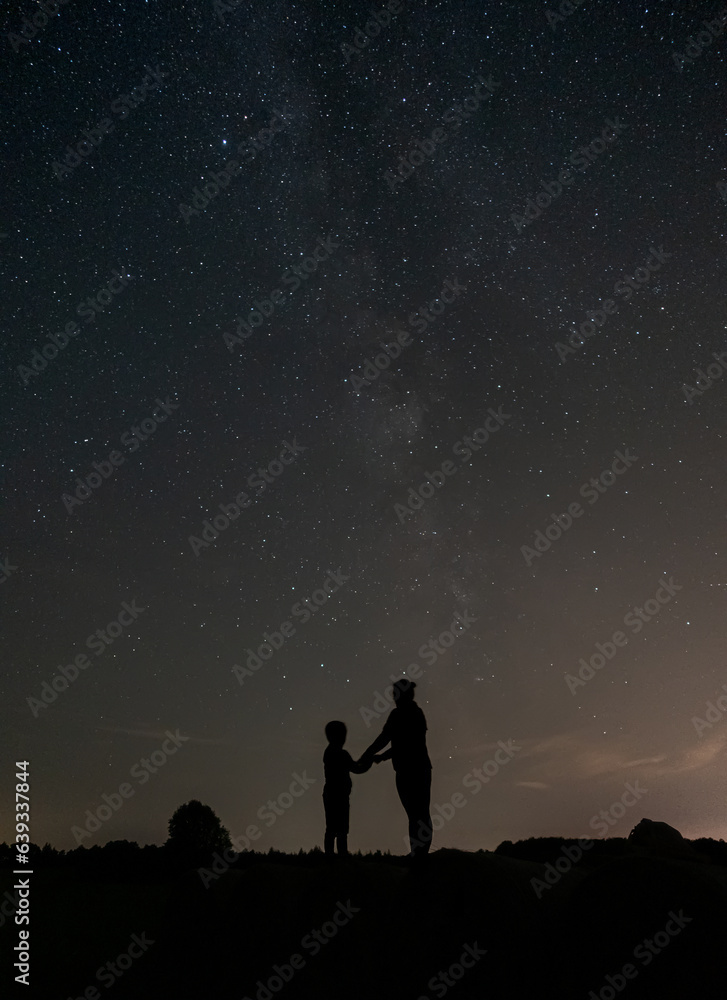 Mother and son under the stars